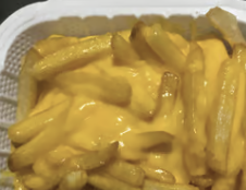 French fries smothered in melted cheese sauce