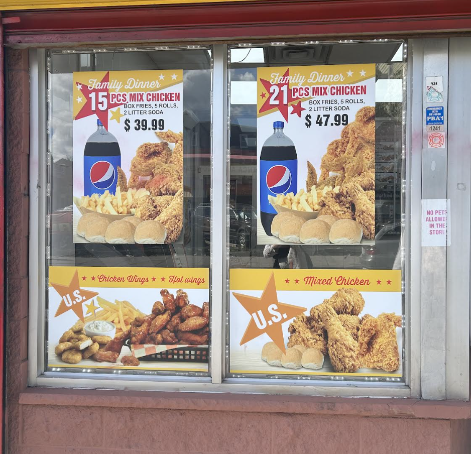 US Fried Chicken family dinner and wings window displays