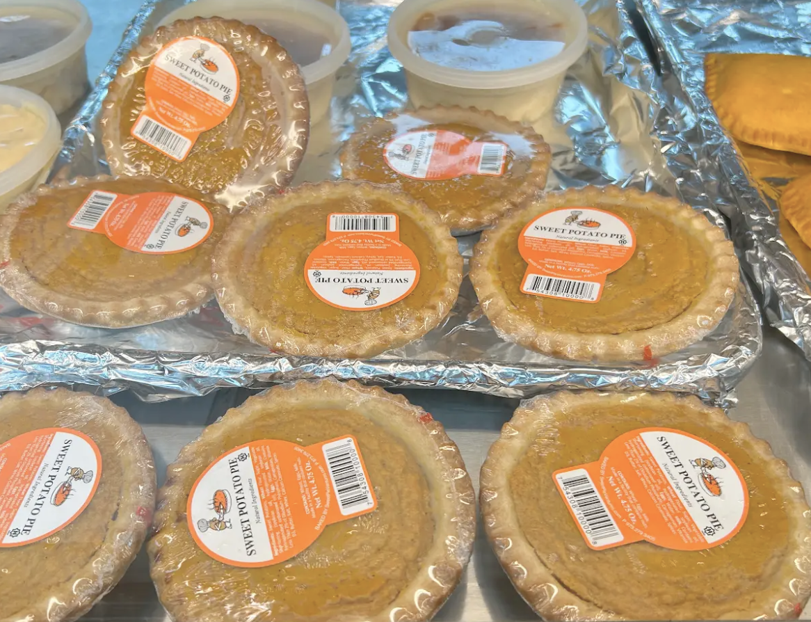 Freshly baked sweet potato pies on foil