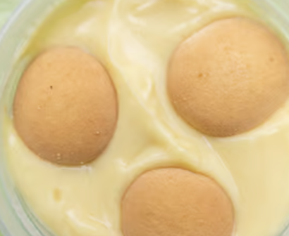Banana pudding topped with vanilla wafer cookies