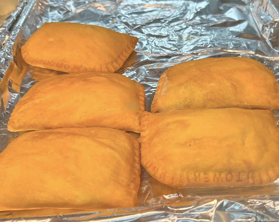 Four golden pastries on foil